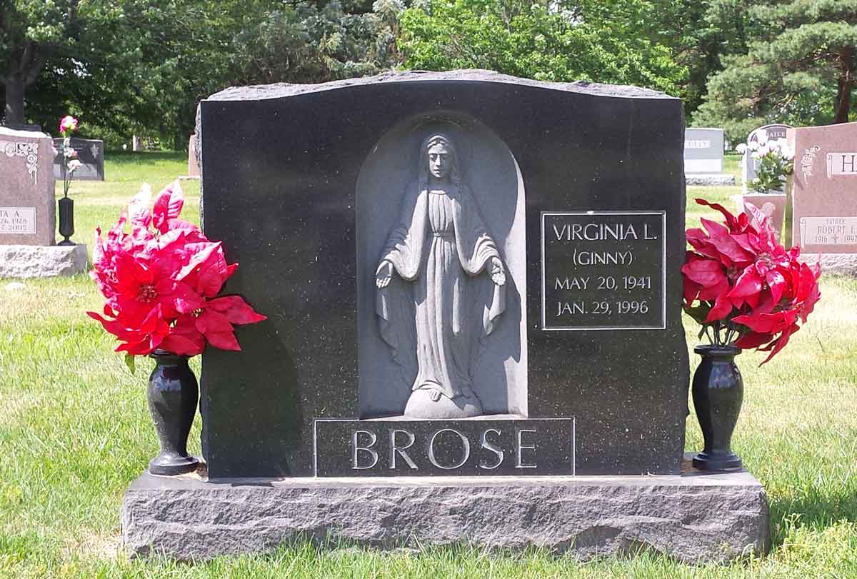 upright headstone with sculpture